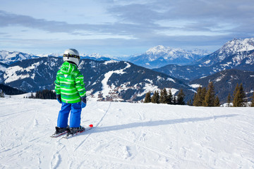 Fototapeta na wymiar Boy has a fun on ski