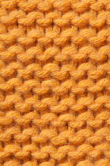 Yellow knitted wool background vertical