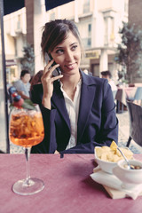 Young Businesswoman Talking on Mobile Phone during a Break