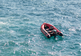 inflatable rubber transport boat floating at sea