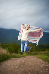 Portrait of a young woman outdoor dancing