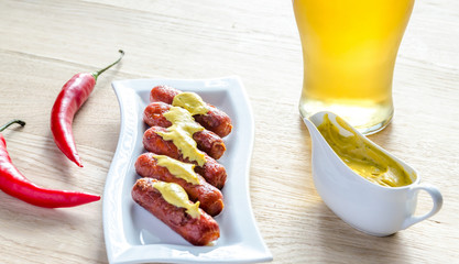 Roasted sausages with glass of beer