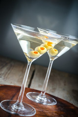 Two olive martini cocktails