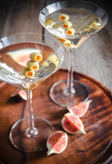 Two olive martini cocktails