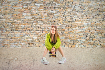 Blonde girl with skate over textured background