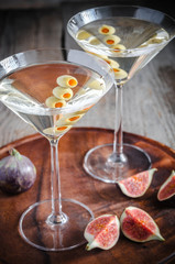 Two olive martini cocktails