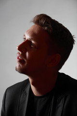 Obraz premium Studio low key portrait of young man