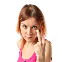 Girl making horn gesture over white background