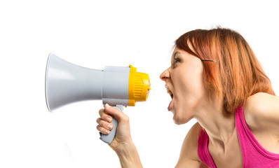 Girl shouting by megaphone over white background