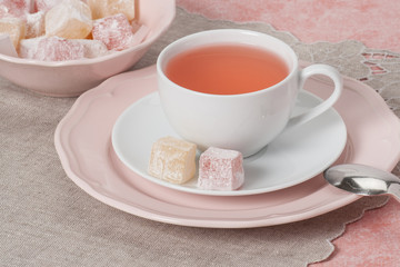 Assorted Turkish Delight. Cup Of Fruit Tea. Natural Linen Napkin