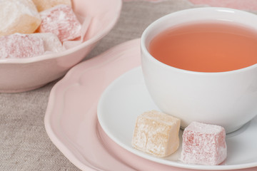 Assorted Turkish Delight. Cup Of Fruit Tea. Natural Linen Napkin
