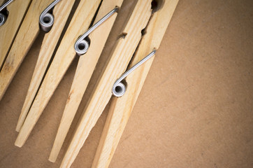 wood clothespin on cardboard background