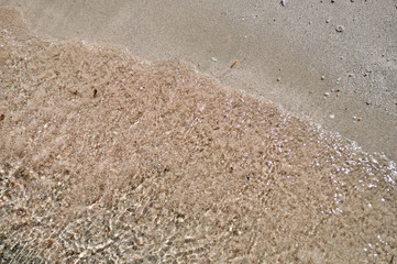 The texture of the sand on the beach.