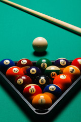 Billiard balls in a pool table.