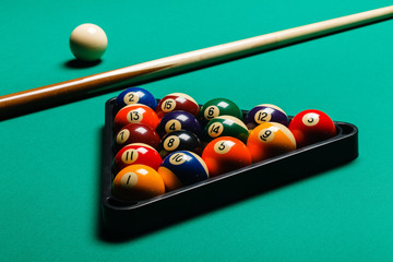 Billiard balls in a pool table.