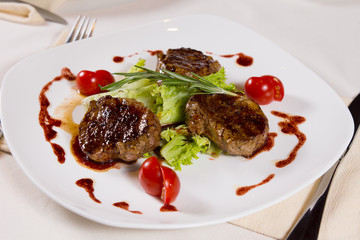 Appetizing Garnished Grilled Meat Dish on Plate