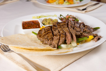 Grilled Steak Fajitas with Fixings on Plate