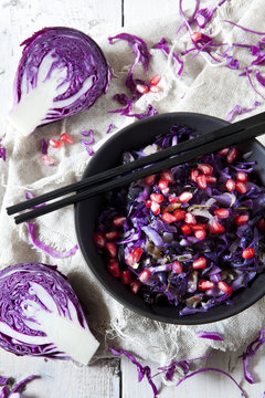 sauteed purple cabbage and pomegranate grains on bowl