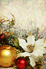 Christmas balls with tinsel and artificial poinsettia