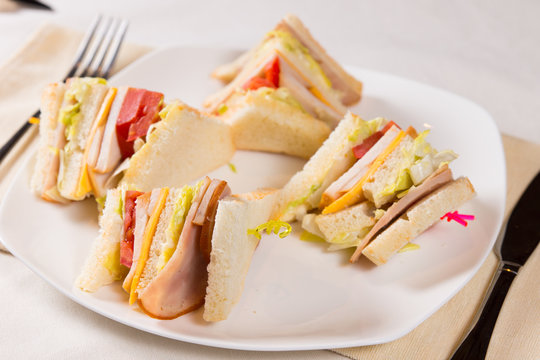 Close Up of Triple Decker Sandwich on Plate