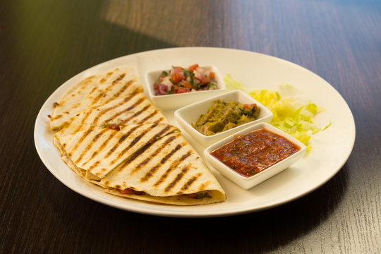 Grilled Quesadilla with Fixings on Plate