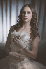 Fototapeta premium Ballet fashion style brunette woman. Wearing white corset. In mi