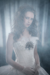 Ballet fashion style brunette woman. Wearing white corset. In mi