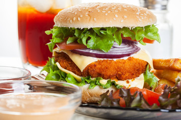 Chicken burger and glass of cola