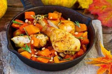 the baked chicken with pumpkin in a pig-iron frying pan
