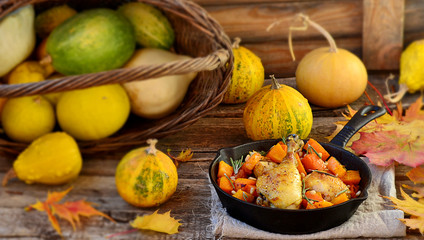 the baked chicken with pumpkin in a pig-iron frying pan