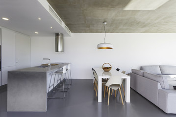 modern kitchen with gray tile floor and white wall