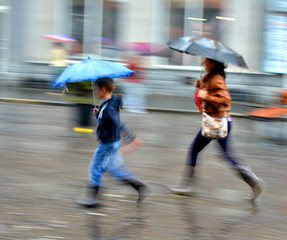 People walking down the street on rainy day