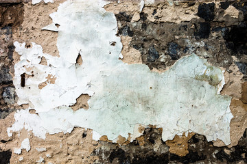 The wall texture with the damaged plaster and whitewash © rootstocks