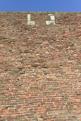 Fortress brick wall and sky as background