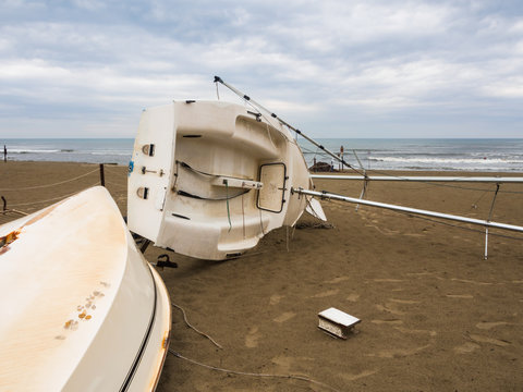 The boat overturned on the beach.