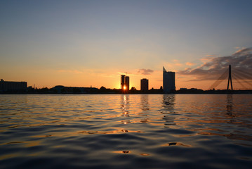 Fototapeta na wymiar Sunset at quay - sun ray through building
