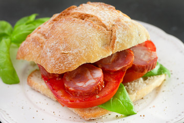 bread with chourico, basil and tomato