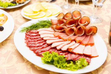 Dish with sliced meat products