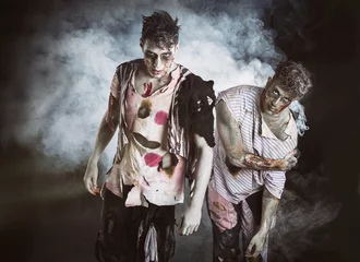 Fotobehang Two male zombies standing on black smoky background © theartofphoto