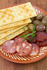 chourico with olives on dish