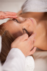 Fototapeta na wymiar Woman relaxing during face massage