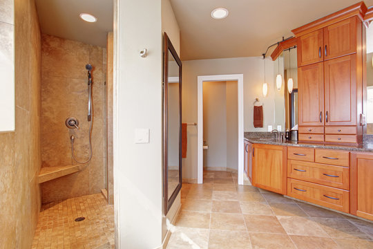 Luxury bathroom with large storage combination and open shower