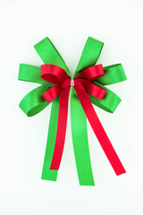 Red and green ribbon bow isolated on white background.