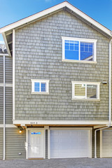 Light olive house in clapboard siding trim
