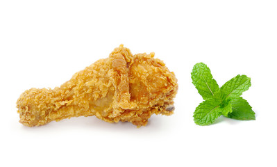 Golden brown fried chicken and mint isolated on white background