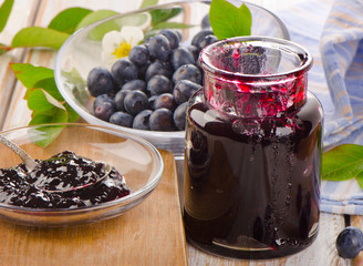 Fresh blueberries jam  on a wooden table.