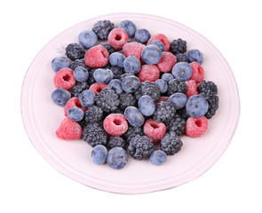 Iced berries on plate, isolated on white background