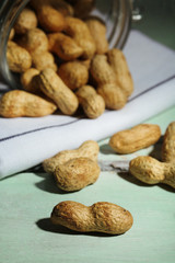 Peanuts on wooden background