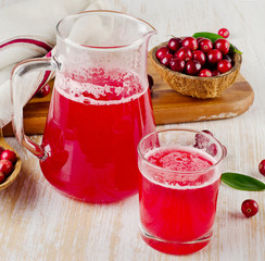 Cranberry drink on  wooden background