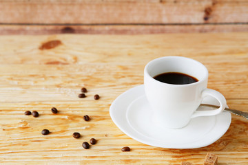 cup of morning coffee on wooden background